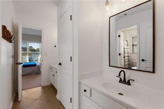 a white toilet sitting next to a bathroom sink
