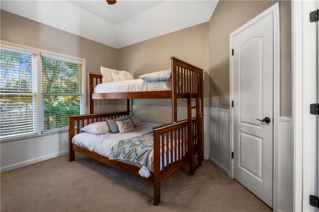 3713 Lake Edge Drive Suwanee, GA 30024 - Photo 35 of 50 a bedroom with a bed and a window