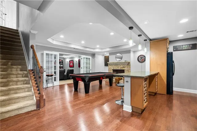 a kitchen with stainless steel appliances granite countertop a stove a sink and a refrigerator