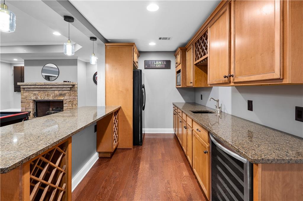 3713 Lake Edge Drive Suwanee, GA 30024 - Photo 38 of 50 a kitchen with stainless steel appliances granite countertop a stove a sink and a refrigerator