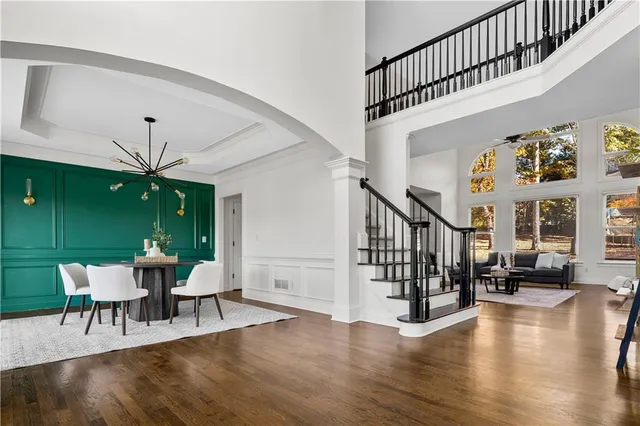 a view of a livingroom with furniture and stairs