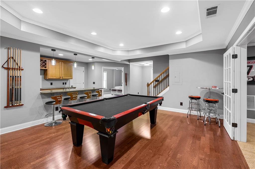 3713 Lake Edge Drive Suwanee, GA 30024 - Photo 41 of 50 a room with furniture pool table gym equipment wooden floor and window