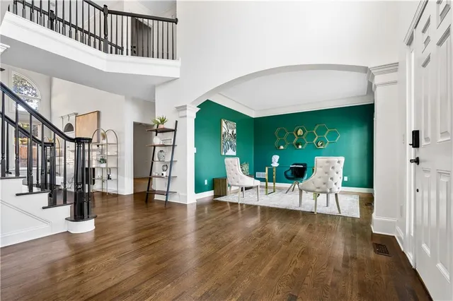 a view of an entryway with wooden floor