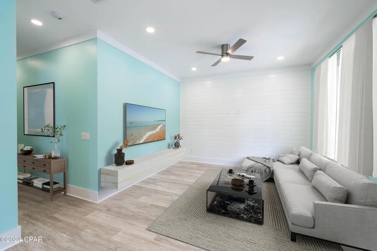 101 4th Street Santa Rosa Beach, FL 32459 - Photo 8 of 16 a living room with furniture and a flat screen tv