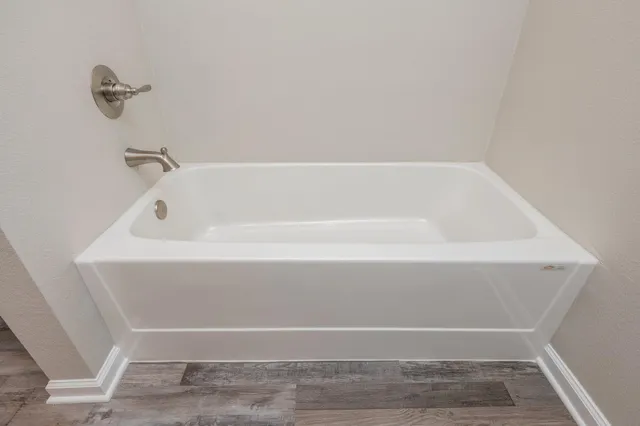 a bathroom with bathtub