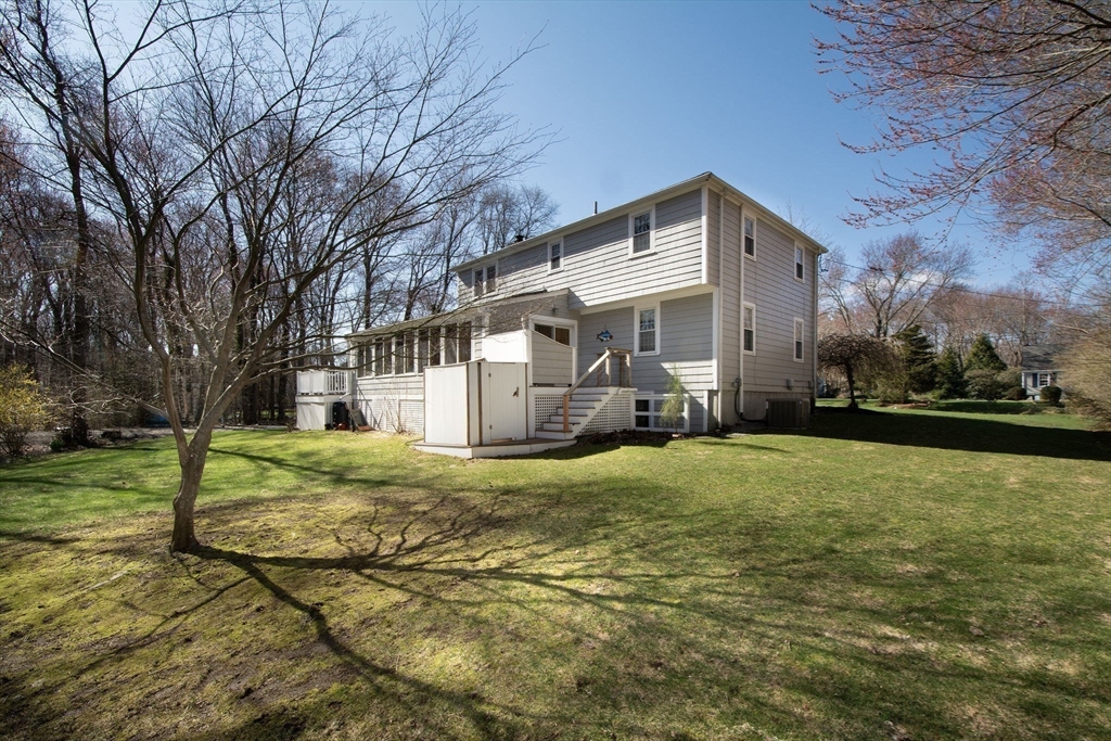 18 Longmeadow Road Scituate, MA 02066 - Photo 36 of 37 a front view of a house with garden