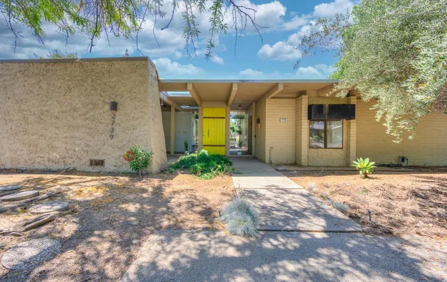 a front view of a house with a yard