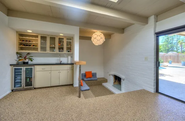 a living room with a couch and a fireplace