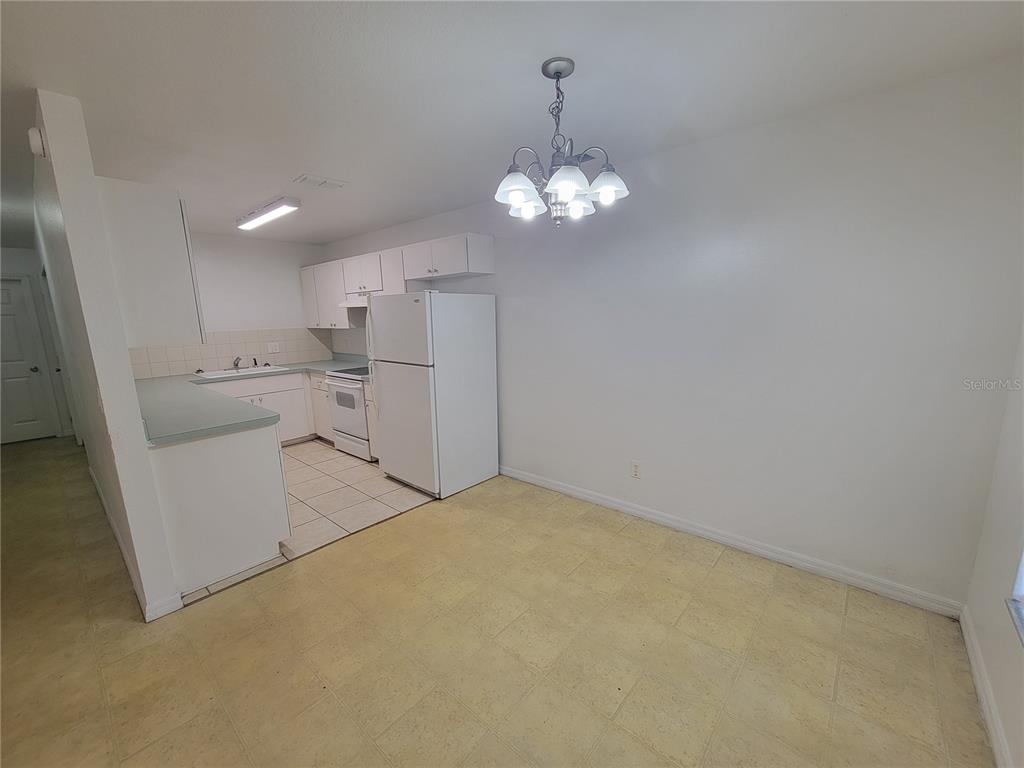 15755 Southwest 33rd Ave Road, Unit 1 Ocala, FL 34473 - Photo 5 of 9 a view of a kitchen with a sink and dishwasher