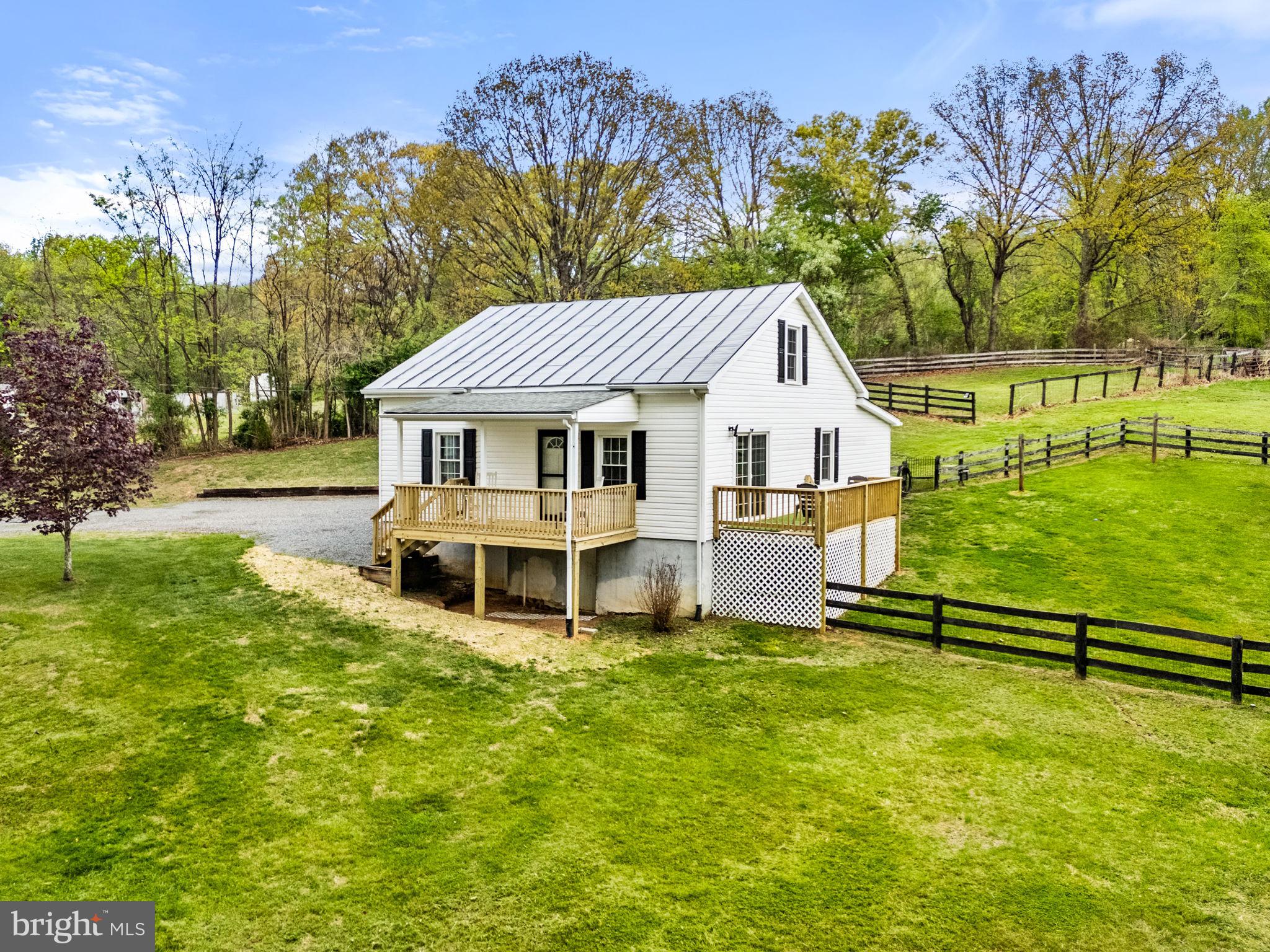 2459 Thoroughfare Road Culpeper, VA 22701 - Photo 15 of 59 a house with green field in front of it
