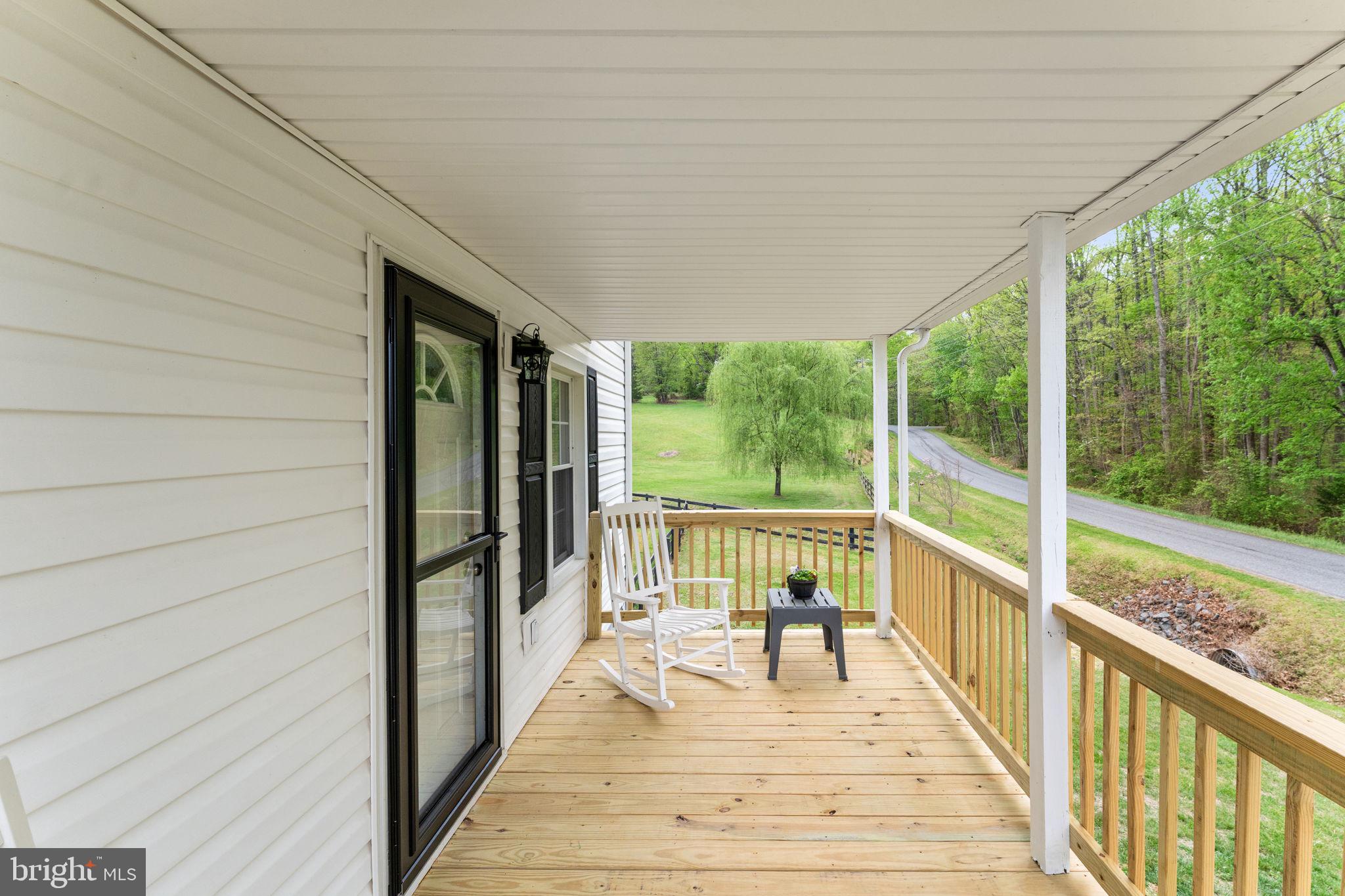 2459 Thoroughfare Road Culpeper, VA 22701 - Photo 17 of 59 a view of balcony with wooden floor and iron stairs