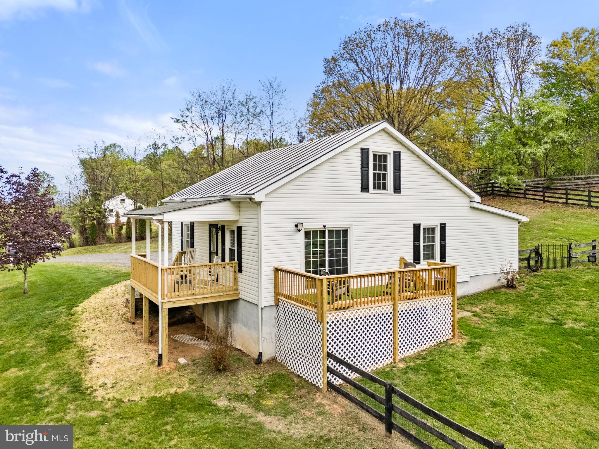 2459 Thoroughfare Road Culpeper, VA 22701 - Photo 2 of 59 a house view with a outdoor seating space