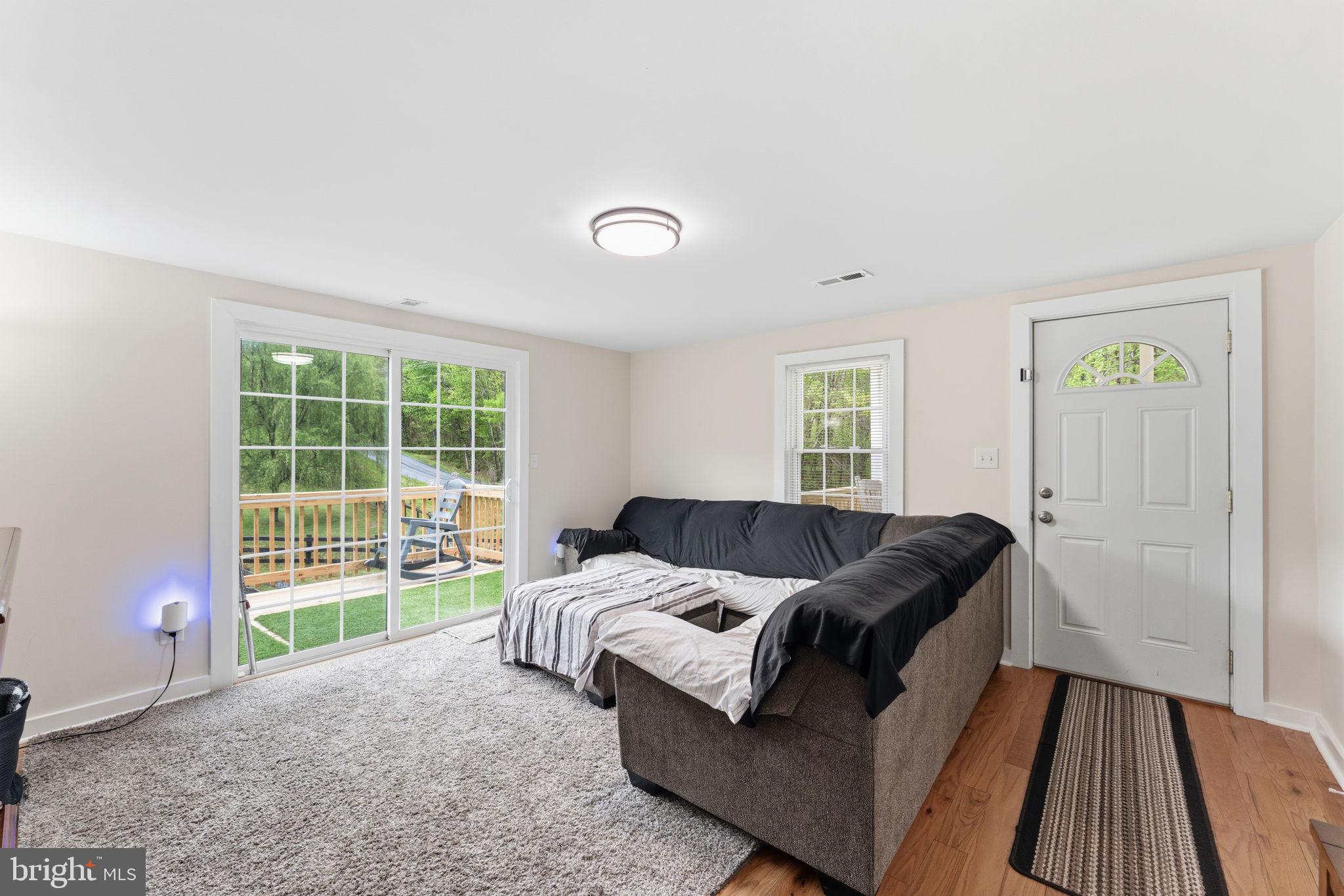 2459 Thoroughfare Road Culpeper, VA 22701 - Photo 21 of 59 a living room with furniture and a window