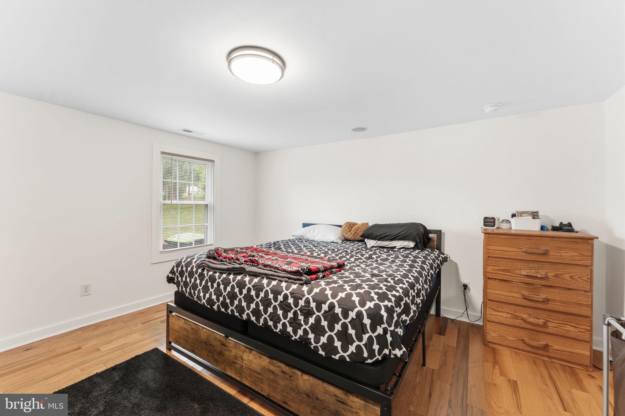 2459 Thoroughfare Road Culpeper, VA 22701 - Photo 22 of 59 a bedroom with a bed and a dresser