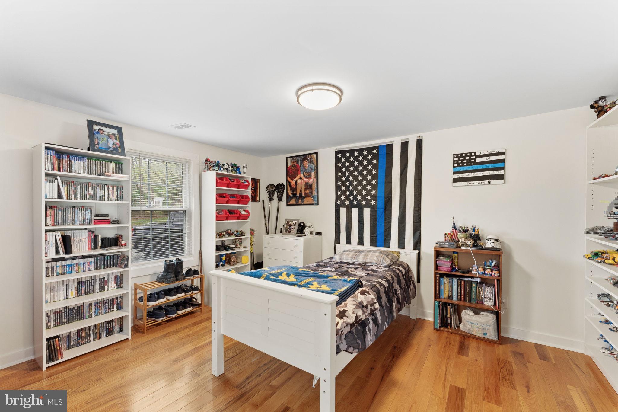 2459 Thoroughfare Road Culpeper, VA 22701 - Photo 23 of 59 a bed sitting in a bedroom next to a book shelf