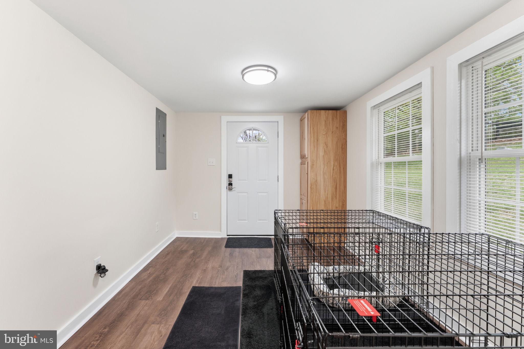 2459 Thoroughfare Road Culpeper, VA 22701 - Photo 24 of 59 a view of a hallway with wooden floor and dining room