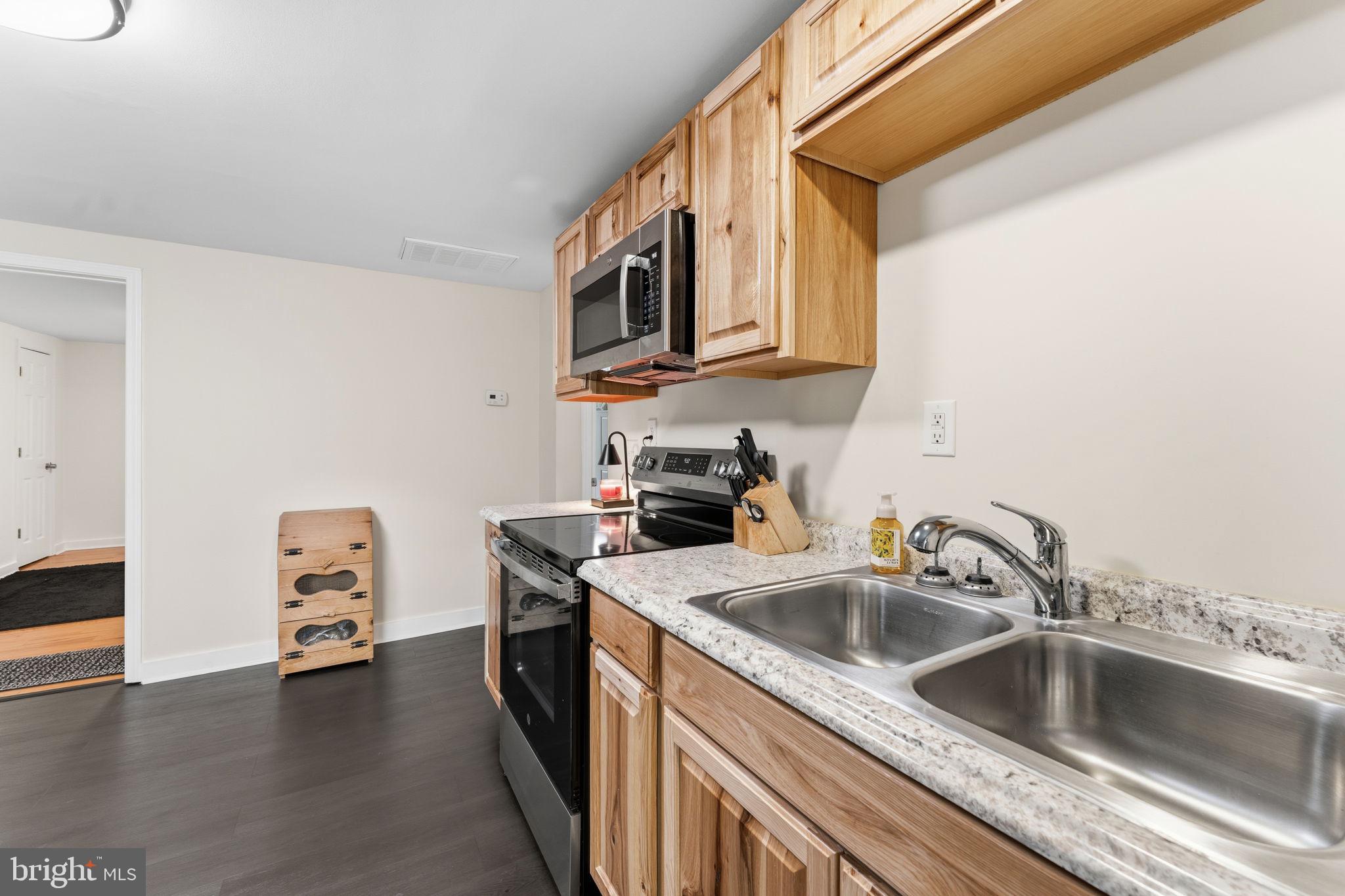 2459 Thoroughfare Road Culpeper, VA 22701 - Photo 33 of 59 a kitchen with a sink and a stove top oven