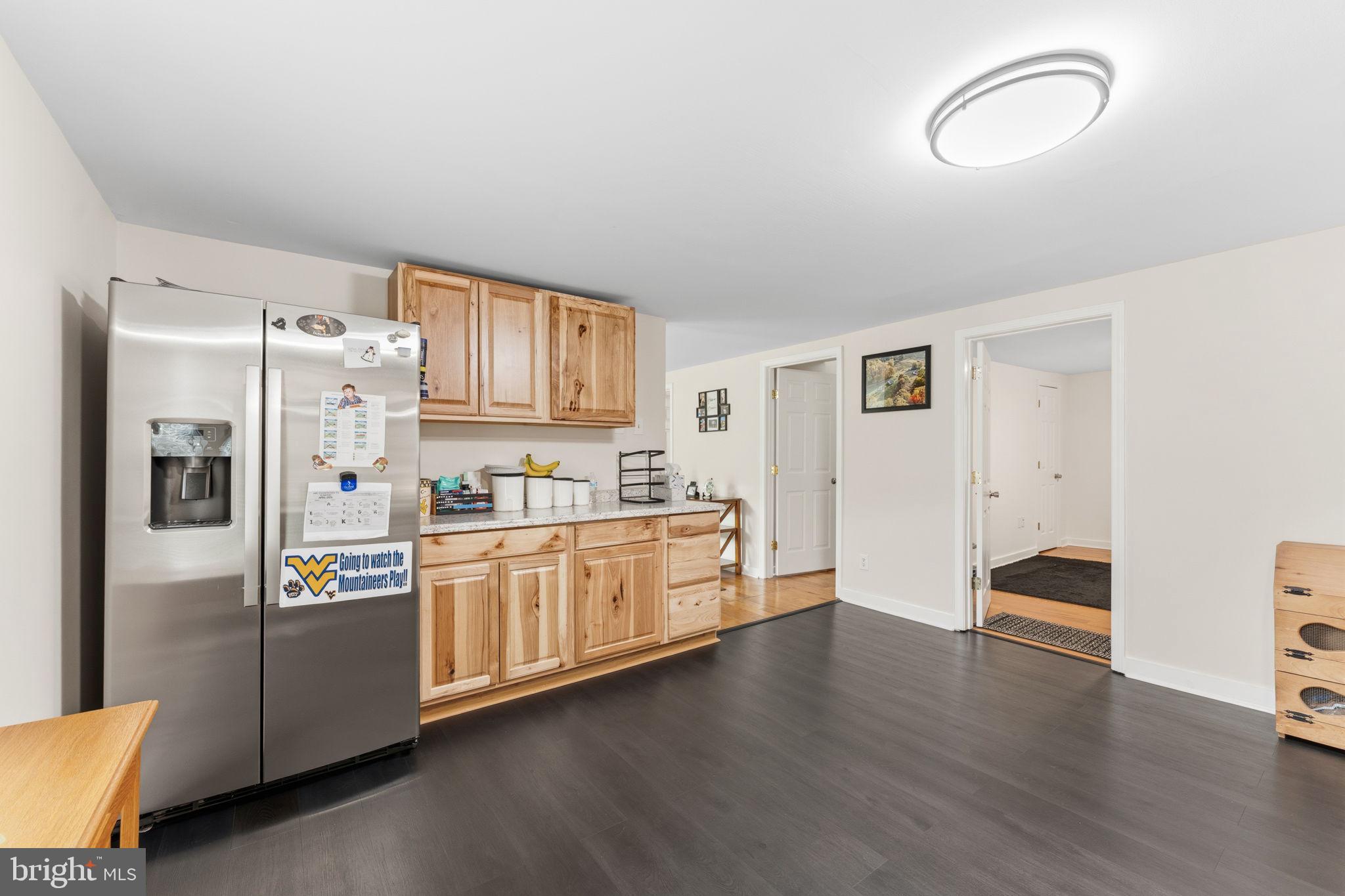 2459 Thoroughfare Road Culpeper, VA 22701 - Photo 40 of 59 a kitchen with stainless steel appliances granite countertop a refrigerator and a stove