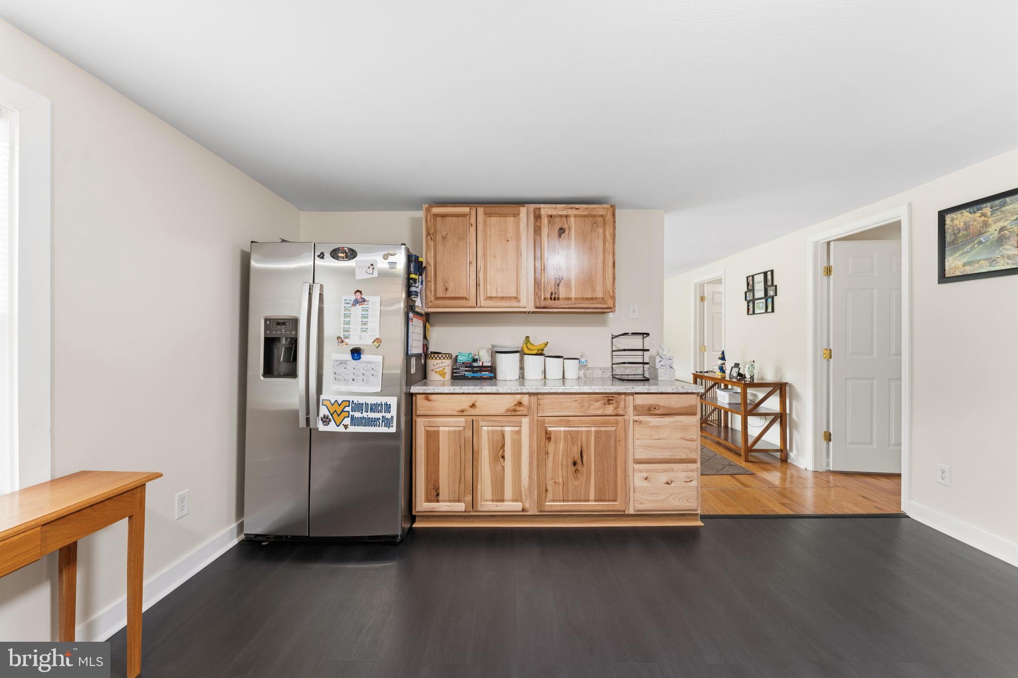 2459 Thoroughfare Road Culpeper, VA 22701 - Photo 41 of 59 a large kitchen with stainless steel appliances granite countertop a refrigerator and a stove top oven