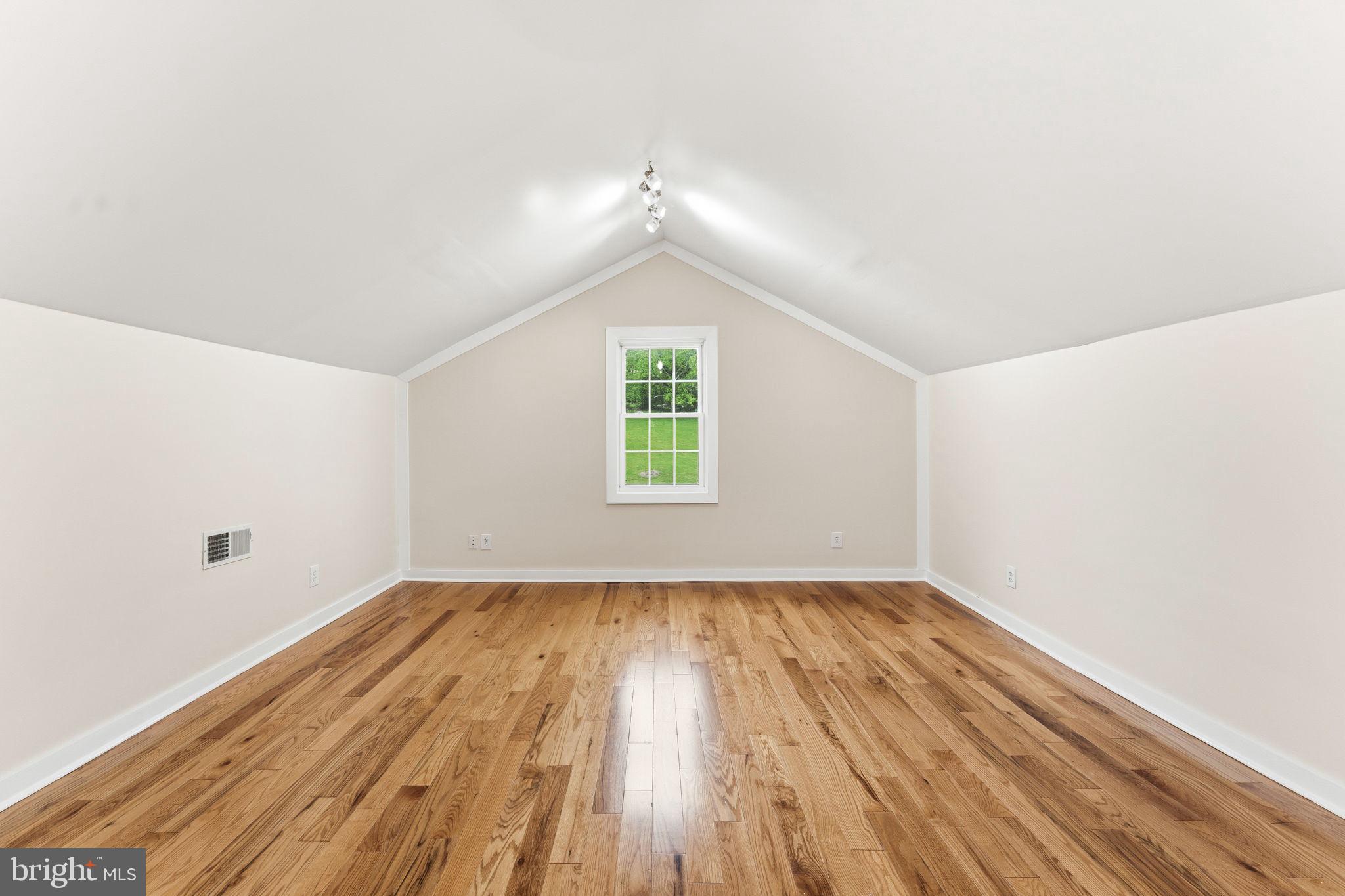 2459 Thoroughfare Road Culpeper, VA 22701 - Photo 48 of 59 an empty room with wooden floor and windows
