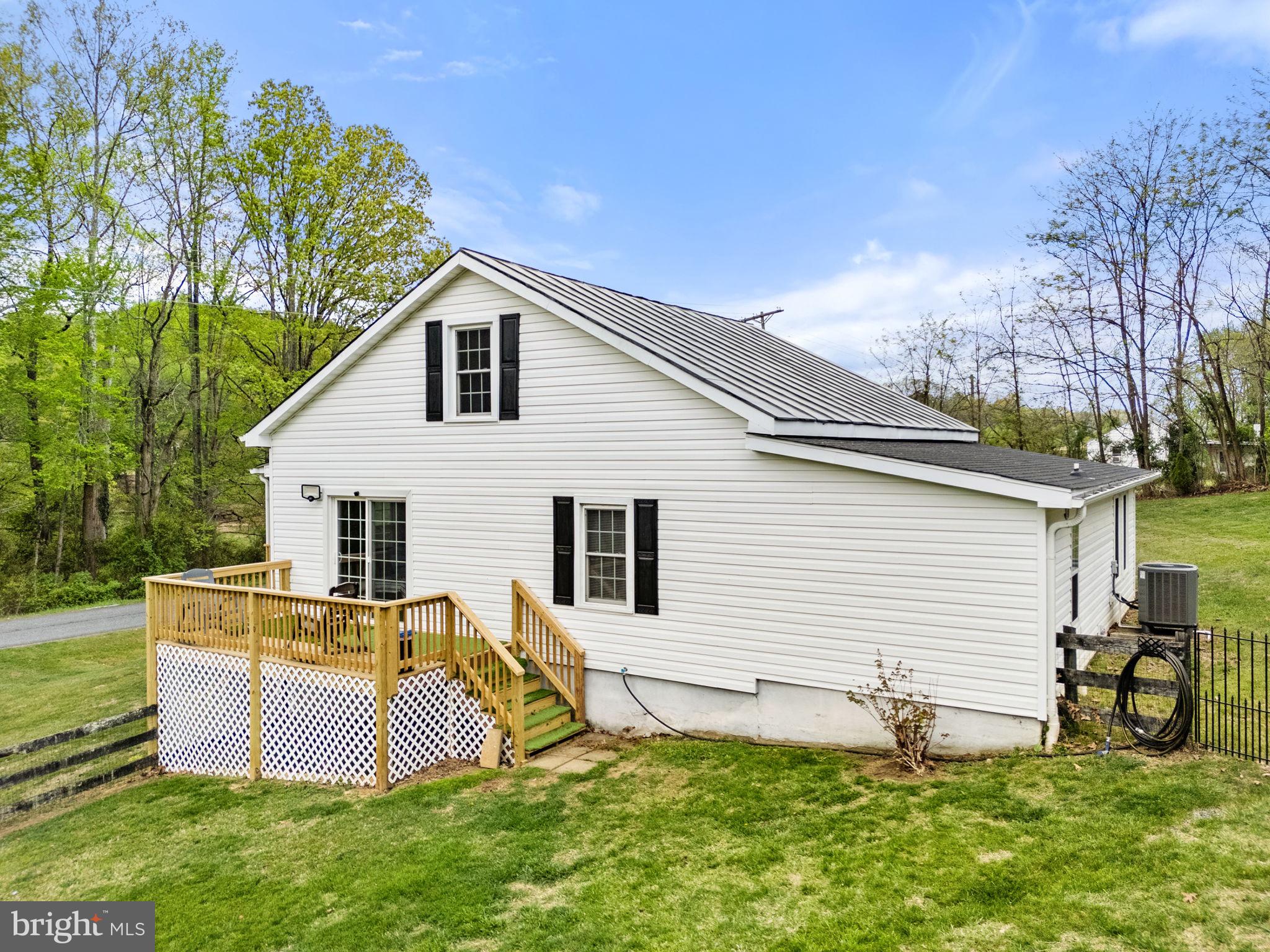 2459 Thoroughfare Road Culpeper, VA 22701 - Photo 5 of 59 a backyard of a house with table and chairs