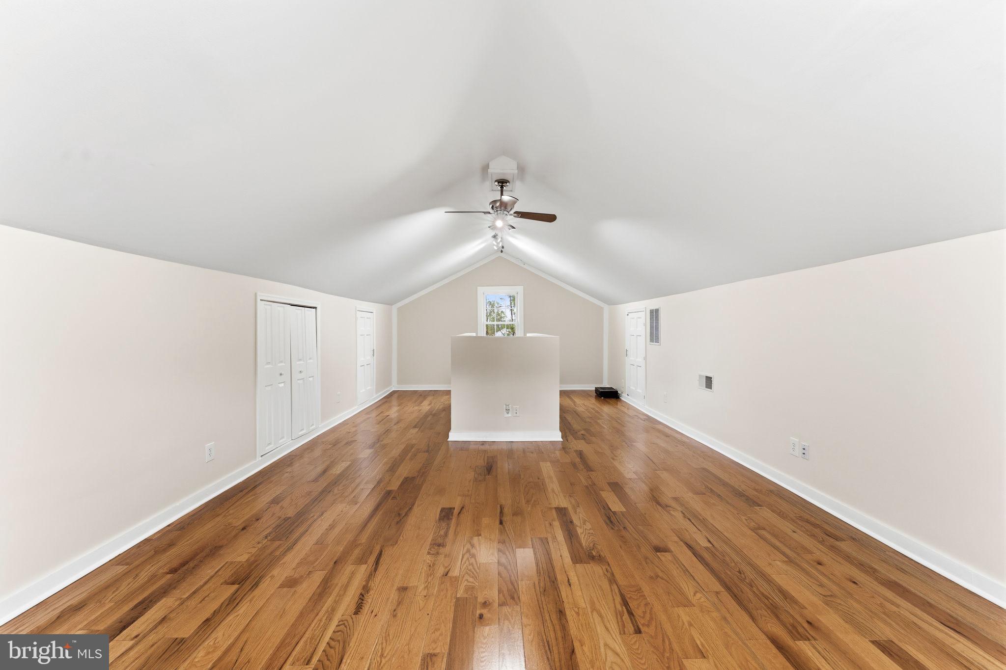 2459 Thoroughfare Road Culpeper, VA 22701 - Photo 52 of 59 a view of a room with wooden floor ceiling fan and window