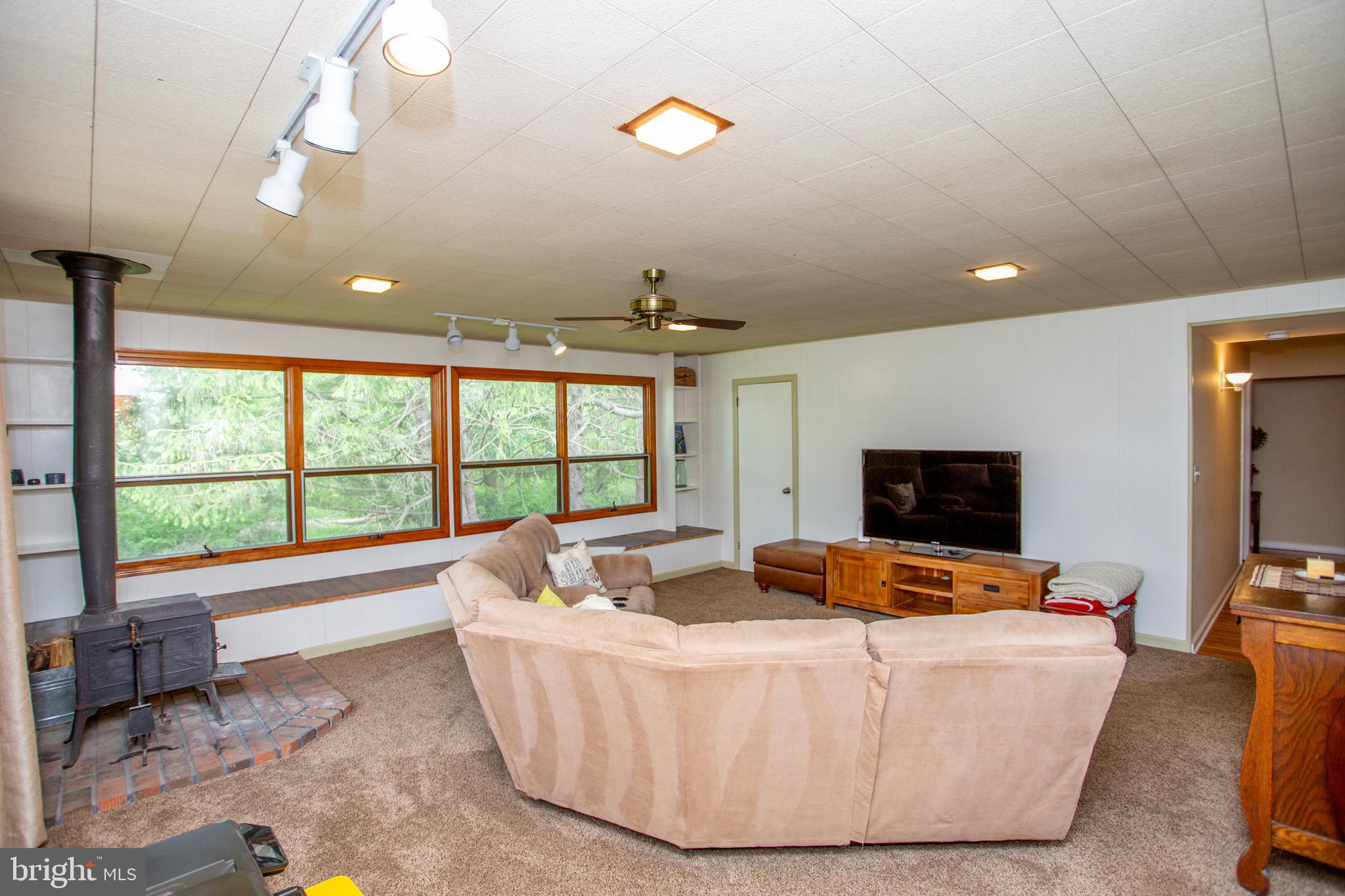 40 Union Road Clinton, NJ 08809 - Photo 15 of 41 Wall of windows looks out to the treelined yard