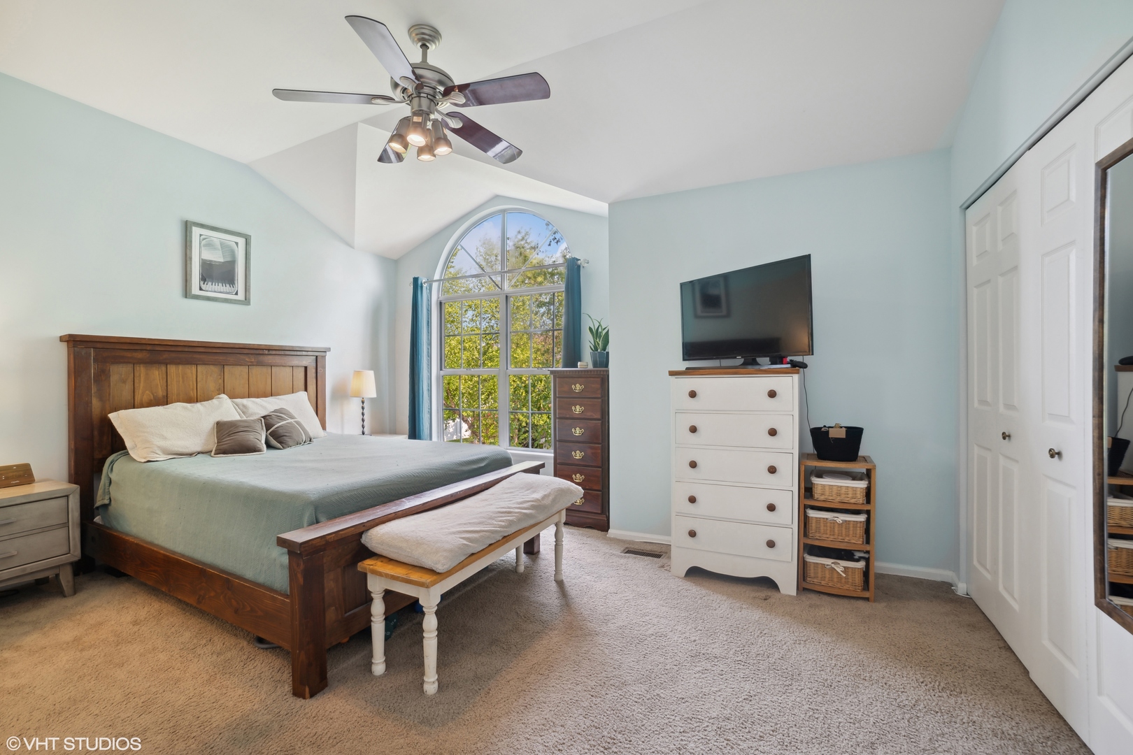 227 Shawnee Circle Bartlett, IL 60103 - Photo 15 of 21 a bedroom with a bed and a flat tv screen on dresser