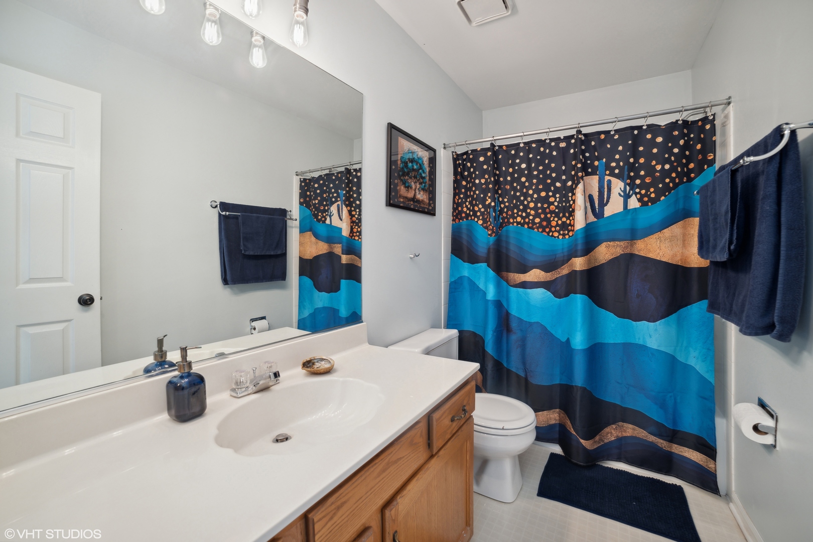 227 Shawnee Circle Bartlett, IL 60103 - Photo 17 of 21 a bathroom with a sink a toilet and a mirror