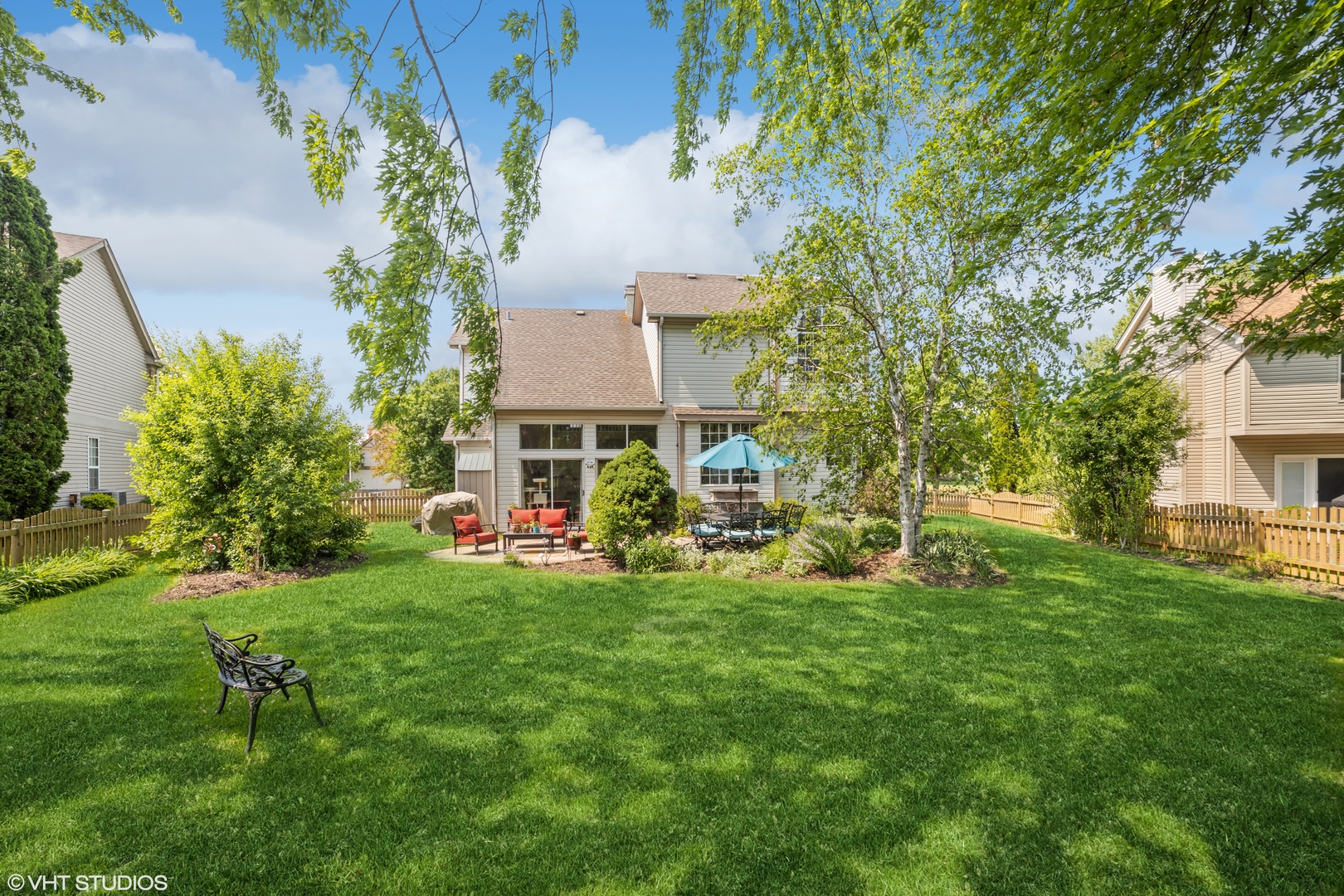 227 Shawnee Circle Bartlett, IL 60103 - Photo 19 of 21 a view of a house with a yard and sitting area
