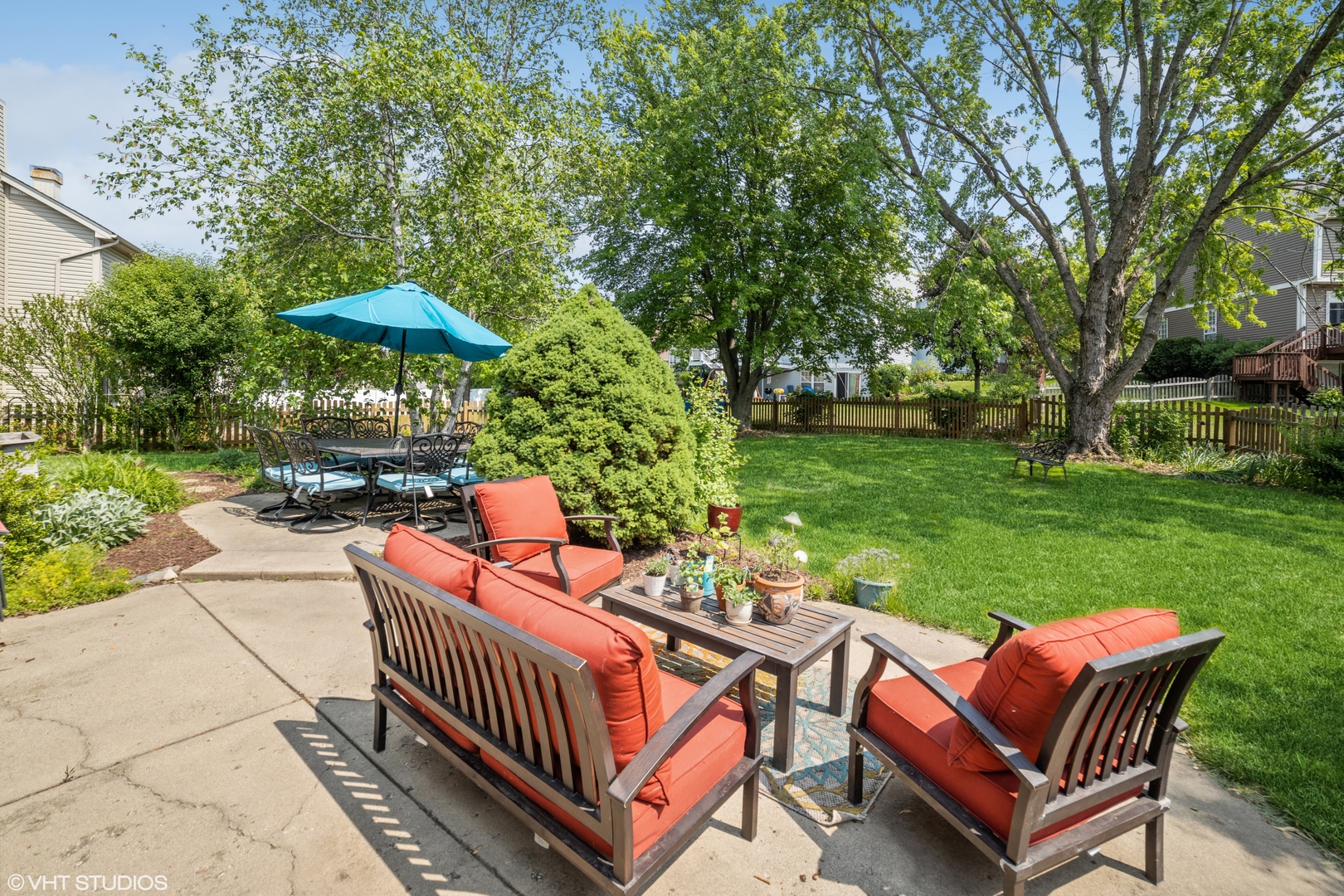 227 Shawnee Circle Bartlett, IL 60103 - Photo 21 of 21 a view of a patio with a table chairs and a fire pit