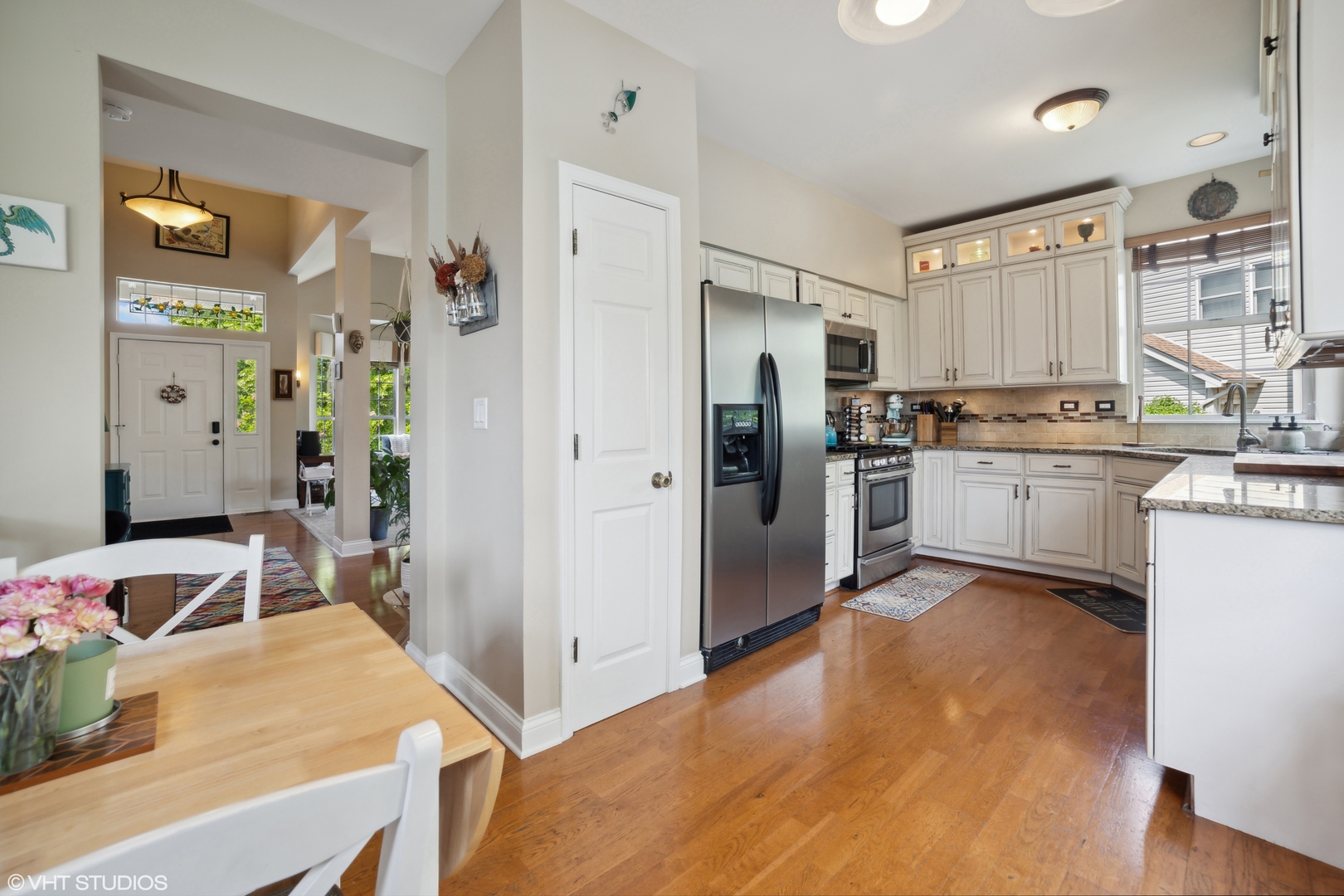 227 Shawnee Circle Bartlett, IL 60103 - Photo 5 of 21 a kitchen with stainless steel appliances granite countertop a sink stove and refrigerator