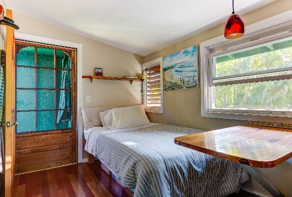 4449 Mahimahi Road Hanalei, HI 96714 - Photo 13 of 20 a bedroom with a bed and a window