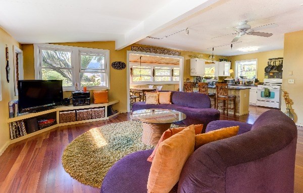4449 Mahimahi Road Hanalei, HI 96714 - Photo 2 of 20 a living room with furniture and a flat screen tv