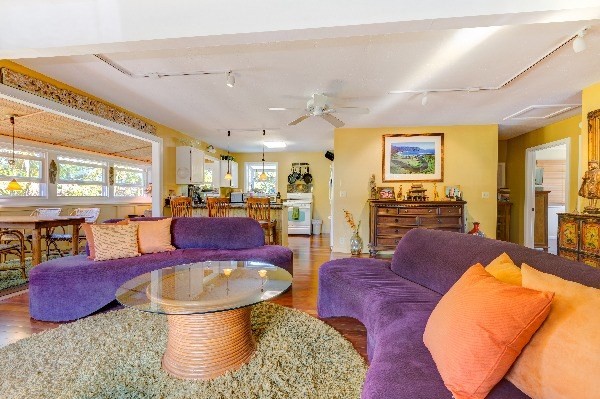 4449 Mahimahi Road Hanalei, HI 96714 - Photo 3 of 20 a living room with furniture a rug and a large window