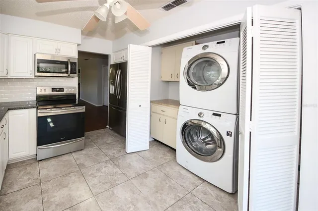 a view of kitchen and washer and dryer
