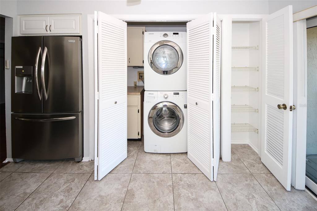 13009 Wedgewood Way, Unit C Hudson, FL 34667 - Photo 15 of 25 a utility room with dryer and washer