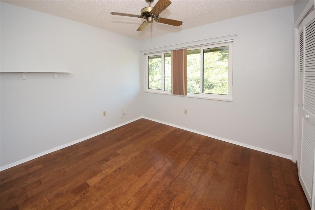 13009 Wedgewood Way, Unit C Hudson, FL 34667 - Photo 8 of 25 an empty room with a window