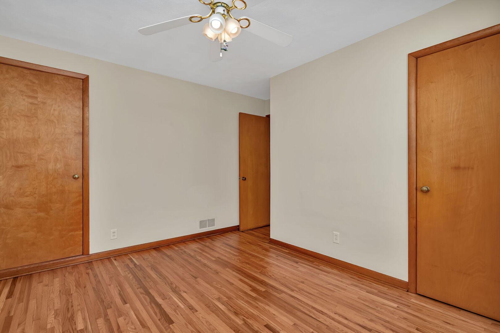 206 South Reed Street Joliet, IL 60436 - Photo 11 of 27 a view of an empty room with wooden floor and a window