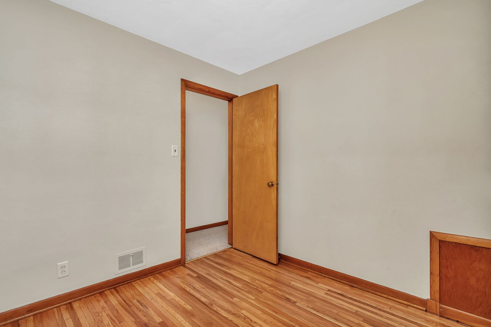 206 South Reed Street Joliet, IL 60436 - Photo 13 of 27 a view of an empty room with wooden floor