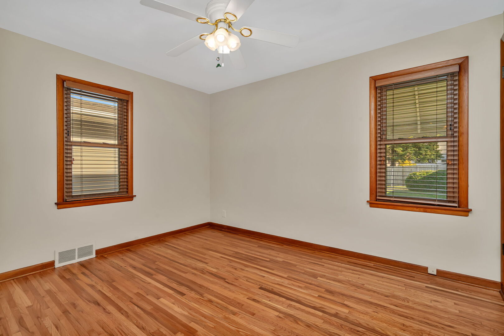 206 South Reed Street Joliet, IL 60436 - Photo 14 of 27 a view of an empty room with wooden floor and a window