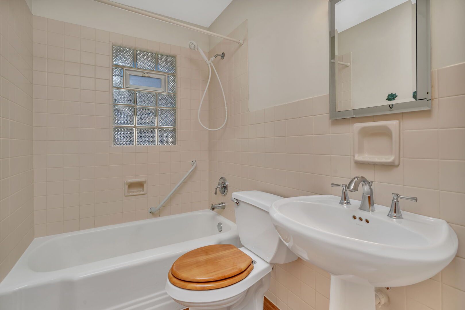 206 South Reed Street Joliet, IL 60436 - Photo 16 of 27 a white toilet sitting next to a bathroom sink