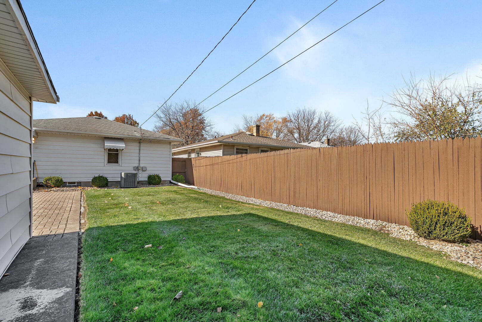 206 South Reed Street Joliet, IL 60436 - Photo 21 of 27 a backyard of a house with lots of green space