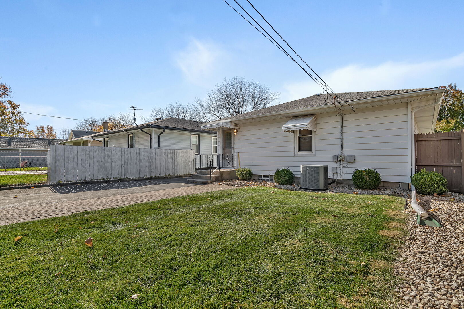 206 South Reed Street Joliet, IL 60436 - Photo 23 of 27 a house view with a backyard space