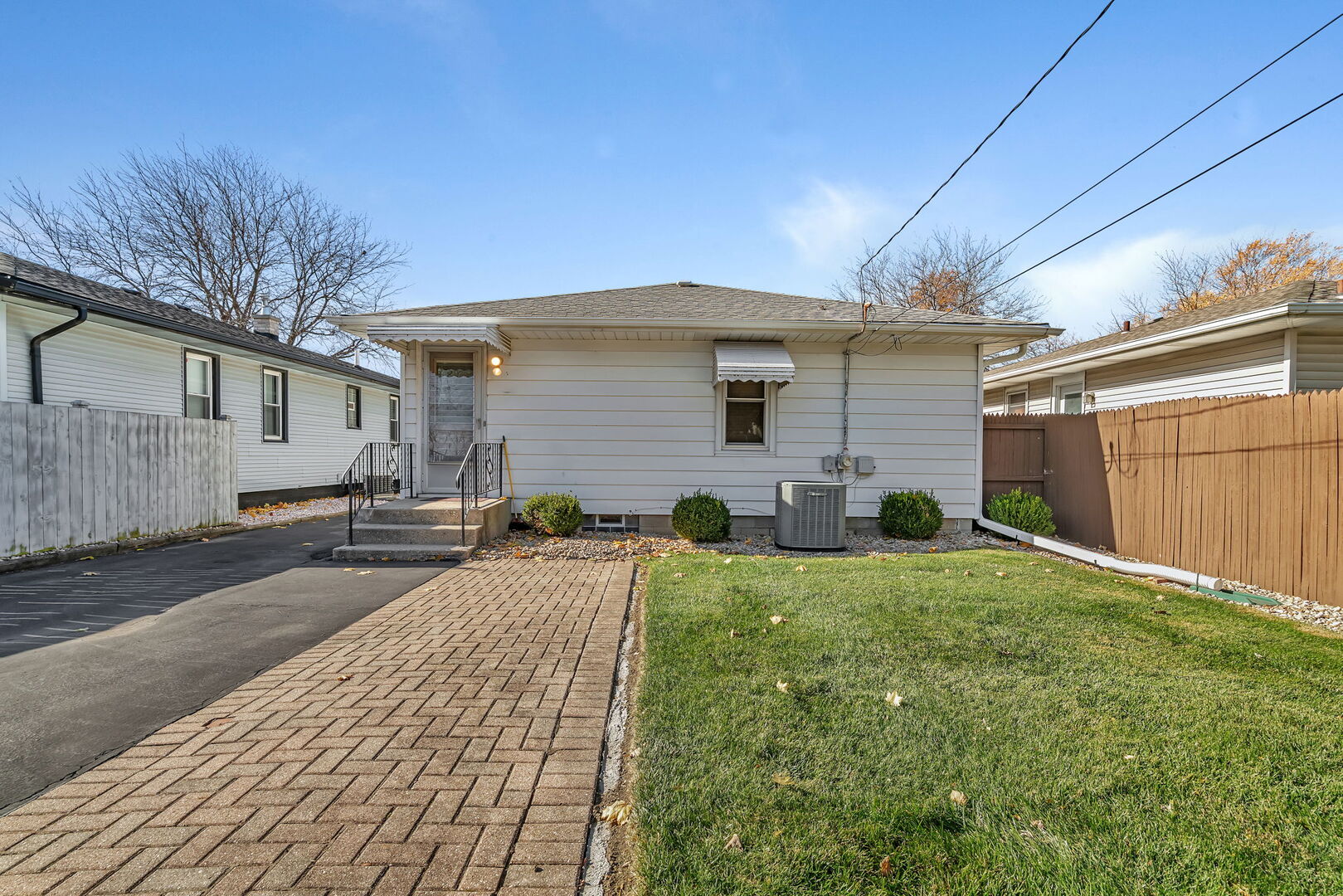 206 South Reed Street Joliet, IL 60436 - Photo 25 of 27 a front view of a house with a yard and garage