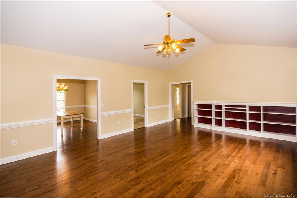 4419 Zack Road Monroe, NC 28110 - Photo 3 of 17 a view of a livingroom with wooden floor and a ceiling fan