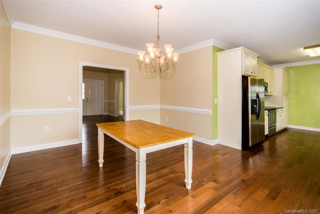 4419 Zack Road Monroe, NC 28110 - Photo 6 of 17 a view of a kitchen with a cabinet and a refrigerator