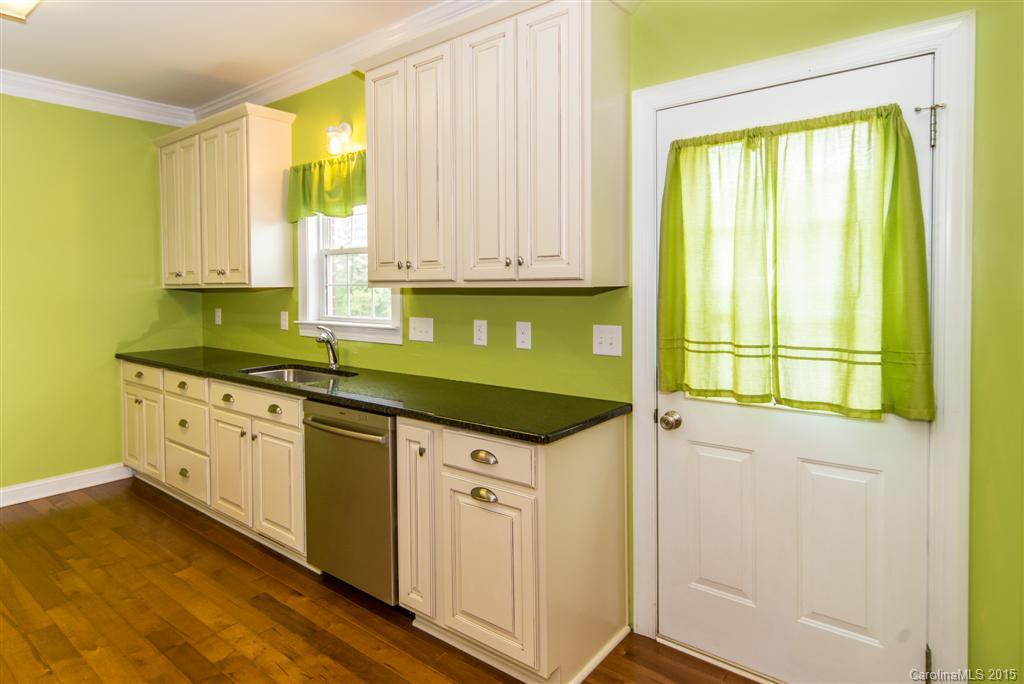 4419 Zack Road Monroe, NC 28110 - Photo 7 of 17 a kitchen with a sink window and cabinets