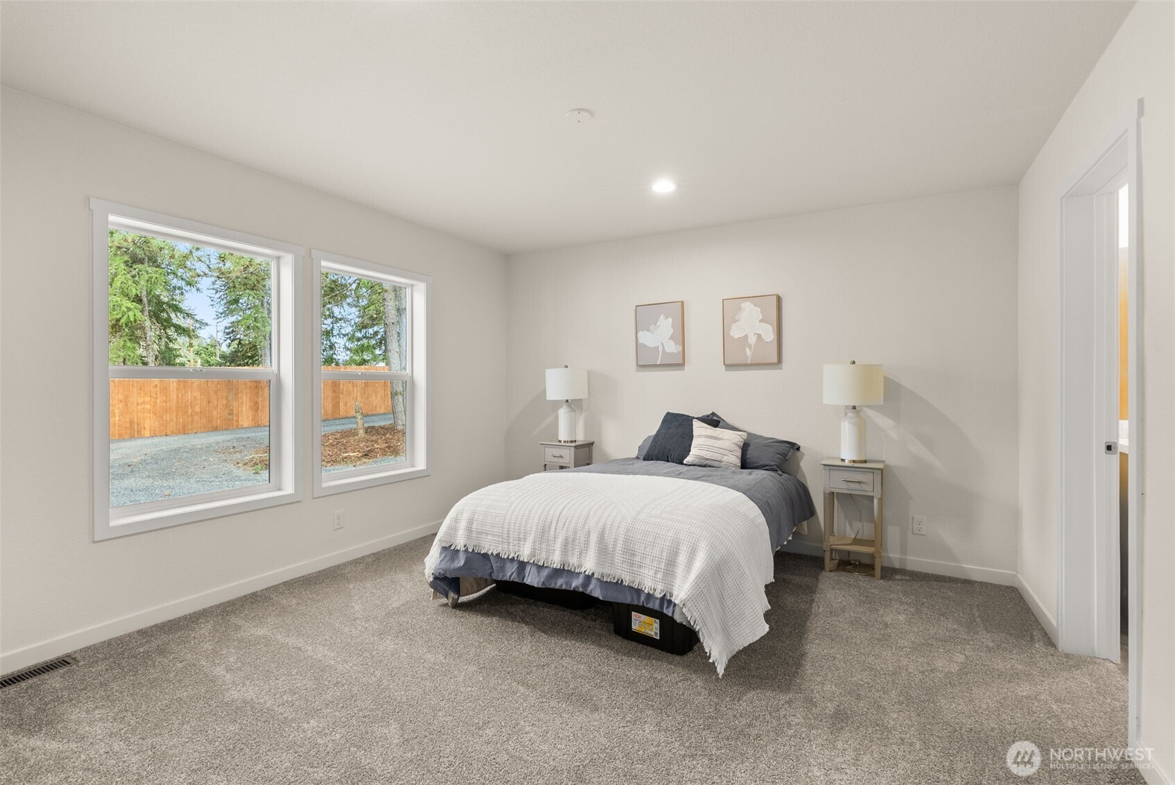 1110 Koontz Road Chehalis, WA 98532 - Photo 15 of 33 a spacious bedroom with a bed and a large window
