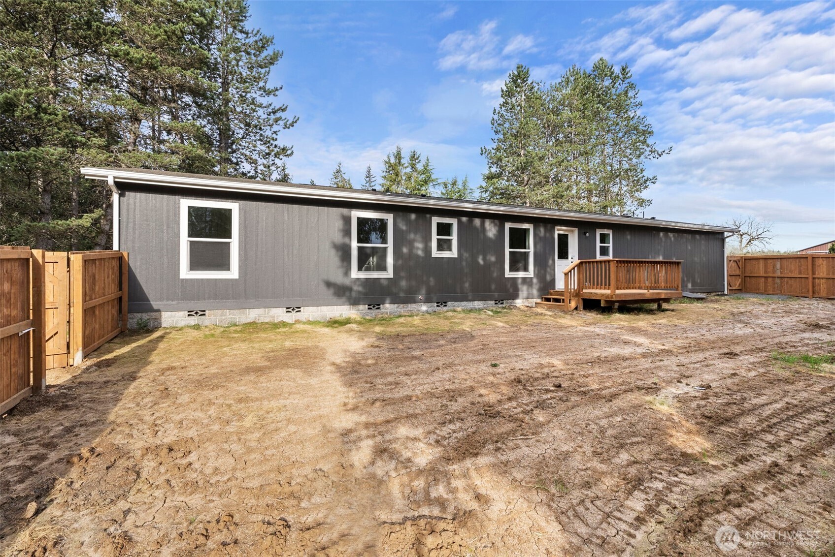 1110 Koontz Road Chehalis, WA 98532 - Photo 28 of 33 a front view of house with yard and trees in the background